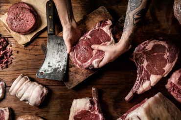 butcher block of fresh cuts of beef