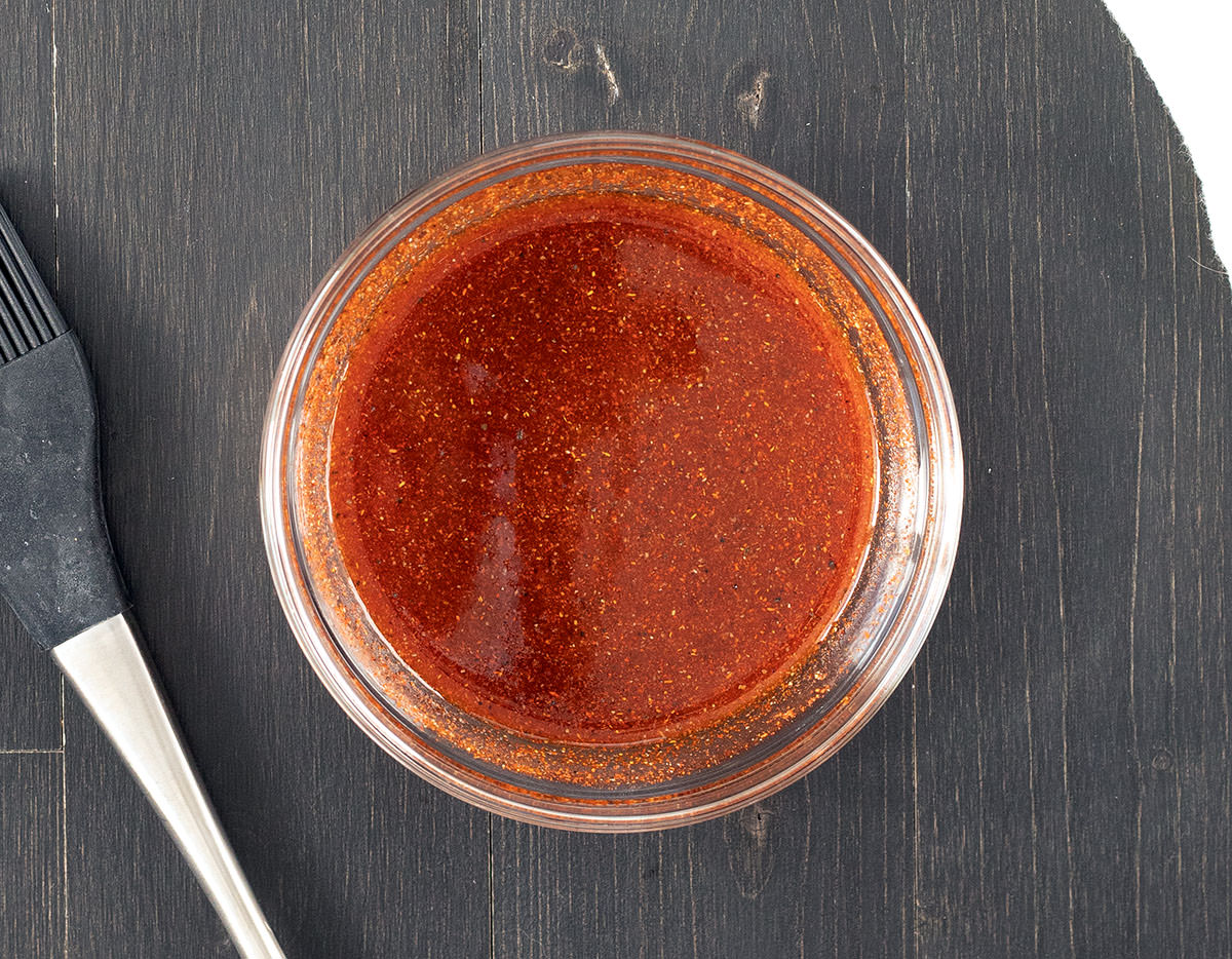 Mop sauce in a small clear bowl.